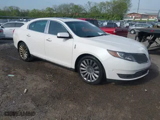 2013 Lincoln MKS with VIN 1LNHL9DK4DG611684, listed as a IAAI auction lot 42043879 with 132,866 mi miles. Bid and sale history available at carsss.com. Image 1.