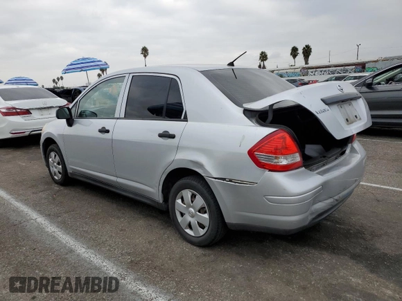 2009 Nissan Versa 1.6 with VIN 3N1CC11E79L429613, listed as a Copart auction lot 72220034 with 134,891 mi miles and Salvage Title. Bid and sale history available at carsss.com. Image 2.