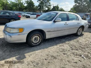 1999 Lincoln Town Car Executive с VIN 1LNHM81W3XY652725, выставлен на аукционе Copart как лот 64511415 с пробегом 181 099 миль миль и Списание • Salvage title. История ставок и продаж доступна на DreamBid. Изображение 1.
