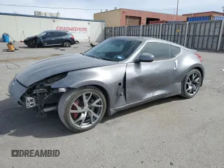 2014 Nissan 370Z z VIN JN1AZ4EH0EM630751, wystawiony jako Copart lot #51489825 z przebiegiem 125 107 mil mil oraz Czysty tytuł • Clean title. Historia ofert i sprzedaży dostępna na DreamBid. Obrazek 1.