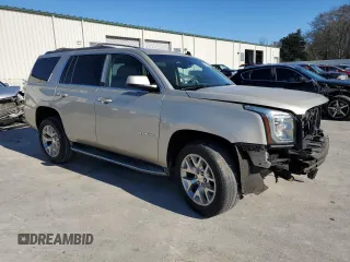 2015 GMC Yukon SLT with VIN 1GKS1BKC7FR120802, listed as a Copart auction lot 87430984 with 191,829 mi miles and Salvage Title. Bid and sale history available at carsss.com. Image 4.