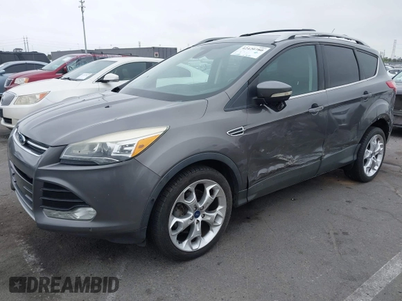 2013 Ford Escape Titanium with VIN 1FMCU0J9XDUD86354, listed as a IAAI auction lot 42420780 with 260,995 mi miles and . Bid and sale history available at DreamBid. Image 2.
