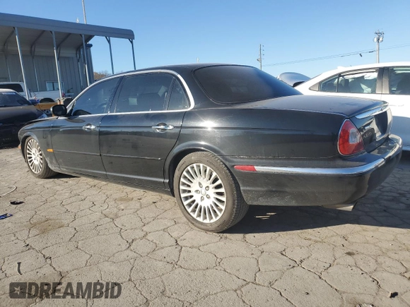 2005 Jaguar XJ Vanden Plas z VIN SAJWA82C75SG45094, wystawiony jako Copart lot #83891564 z przebiegiem 57 467 mil mil oraz Szkoda całkowita • Salvage title. Historia ofert i sprzedaży dostępna na DreamBid. Obrazek 2.
