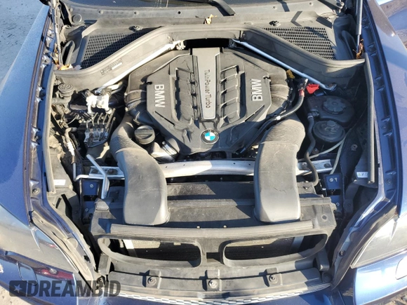 2014 BMW X6 50i z VIN 5UXFG8C53EL592803, wystawiony jako Copart lot #79621904 z przebiegiem 154 595 mil mil oraz Szkoda całkowita • Salvage title. Historia ofert i sprzedaży dostępna na DreamBid. Obrazek 12.