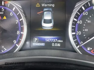2015 Infiniti Q50 Premium z VIN JN1BV7AP1FM346254, wystawiony jako IAAI lot #42147947 z przebiegiem 147 737 mil mil oraz . Historia ofert i sprzedaży dostępna na DreamBid. Obrazek 13.