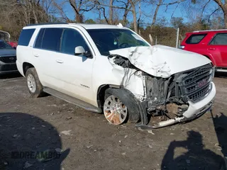 2019 GMC Yukon SLT with VIN 1GKS2BKC9KR166896, listed as a IAAI auction lot 41429865 with 165,174 mi miles. Bid and sale history available at carsss.com. Image 1.