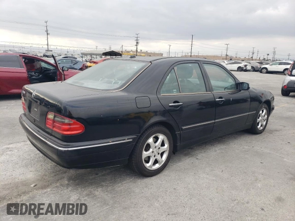 2002 Mercedes-Benz E-Class with VIN WDBJF65J42B486633, listed as a Copart auction lot 76979054 with 151,429 mi miles and Salvage Title. Bid and sale history available at carsss.com. Image 3.