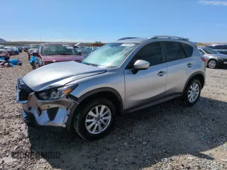 2014 Mazda CX-5 Sport z VIN JM3KE4BEXE0387827, wystawiony jako Copart lot #57497055 z przebiegiem 124 259 mil mil oraz Szkoda całkowita • Salvage title. Historia ofert i sprzedaży dostępna na DreamBid. Obrazek 1.