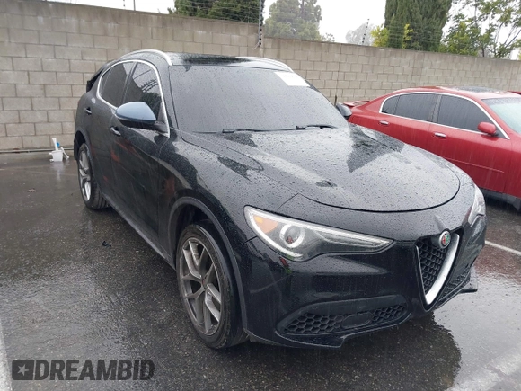 2018 Alfa Romeo Stelvio z VIN ZASFAKANXJ7C23921, wystawiony jako IAAI lot #38783836 z przebiegiem 93 482 mil mil oraz . Historia ofert i sprzedaży dostępna na DreamBid. Obrazek 1.