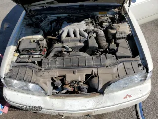 1994 Infiniti Q45 z VIN JNKNG01D3RM252218, wystawiony jako Copart lot #77230944 z przebiegiem 69 069 mil mil oraz Tytuł czysty. Historia ofert i sprzedaży dostępna na DreamBid. Obrazek 11.