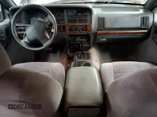 1996 Jeep Grand Cherokee Laredo with VIN 1J4GZ58S0TC402024, listed as a Copart auction lot 65074774 with 163,477 mi miles and Salvage Title. Bid and sale history available at carsss.com. Image 8.