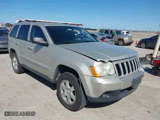 2010 Jeep Grand Cherokee Laredo with VIN 1J4PS4GK1AC111965, listed as a IAAI auction lot 41776362 with 209,042 mi miles. Bid and sale history available at carsss.com. Image 1.