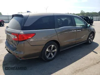 2019 Honda Odyssey Touring z VIN 5FNRL6H87KB098010, wystawiony jako Copart lot #54791505 z przebiegiem 94 477 mil mil oraz Szkoda całkowita • Salvage title. Historia ofert i sprzedaży dostępna na DreamBid. Obrazek 3.
