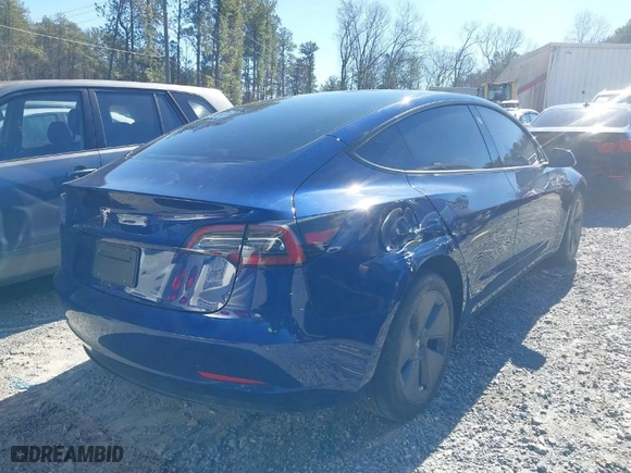 2023 Tesla Model 3 with VIN 5YJ3E1EA8PF671465, listed as a IAAI auction lot 41599200 with 21,859 mi miles. Bid and sale history available at carsss.com. Image 4.