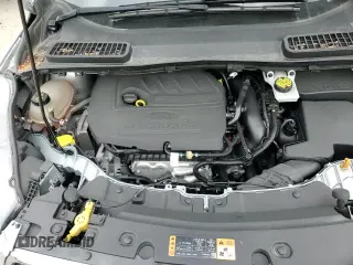 2018 Ford Escape SE z VIN 1FMCU9GD0JUD13327, wystawiony jako Copart lot #87186895 z przebiegiem 74 784 mil mil oraz Szkoda całkowita • Salvage title. Historia ofert i sprzedaży dostępna na DreamBid. Obrazek 14.