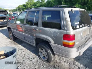 1997 Jeep Grand Cherokee Laredo with VIN 1J4GZ58S1VC603868, listed as a IAAI auction lot 42467813 with 297,306 mi miles and . Bid and sale history available at DreamBid. Image 3.