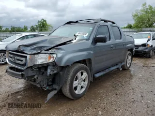 2011 Honda Ridgeline RTL with VIN 5FPYK1F52BB009042, listed as a Copart auction lot 69439004 with 119,889 mi miles and Salvage Title. Bid and sale history available at carsss.com. Image 1.