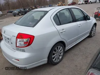 2012 Suzuki SX4 with VIN JS2YC5A52C6300339, listed as a IAAI auction lot 41829263 with 63,717 mi miles and . Bid and sale history available at DreamBid. Image 4.