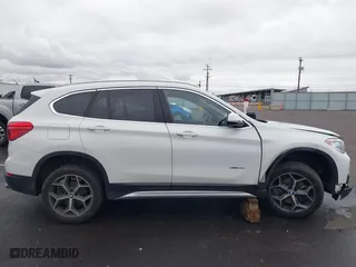 2018 BMW X1 sDrive28i with VIN WBXHU7C32J5H44246, listed as a IAAI auction lot 41477050 with 69,858 mi miles. Bid and sale history available at carsss.com. Image 13.