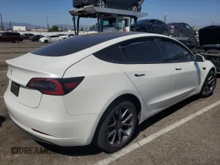 2023 Tesla Model 3 with VIN 5YJ3E1EA8PF394705, listed as a Copart auction lot 52319945 with 58,193 mi miles and Salvage title. Bid and sale history available at DreamBid. Image 3.