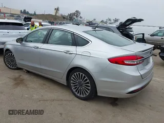 2017 Ford Fusion Hybrid Titanium z VIN 3FA6P0RU7HR300311, wystawiony jako IAAI lot #42045664 z przebiegiem 136 231 mil mil oraz . Historia ofert i sprzedaży dostępna na DreamBid. Obrazek 3.