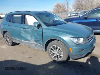 2021 Volkswagen Tiguan SE with VIN 3VV2B7AXXMM089913, listed as a IAAI auction lot 41402158 with 68,158 mi miles and . Bid and sale history available at DreamBid. Image 1.