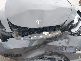 2024 Tesla Model Y with VIN 7SAYGDED3RF002246, listed as a IAAI auction lot 41566184 with 10,316 mi miles and . Bid and sale history available at DreamBid. Image 11.