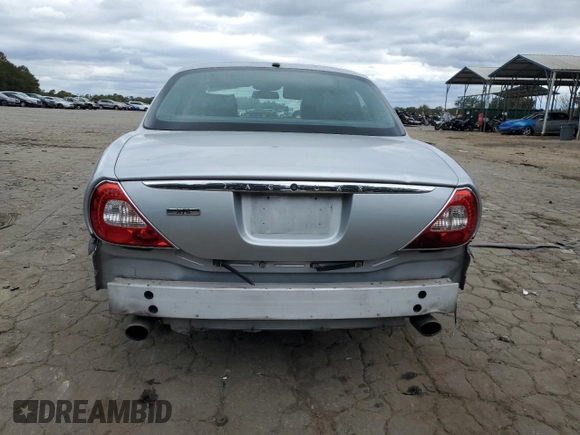 2007 Jaguar XJ with VIN SAJWA71B17SH14626, listed as a Copart auction lot 71013573 with 156,134 mi miles and Salvage Title. Bid and sale history available at carsss.com. Image 6.