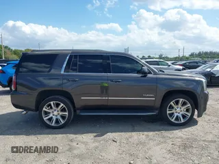 2016 GMC Yukon SLT with VIN 1GKS2BKC2GR277460, listed as a IAAI auction lot 42027026 with 111,191 mi miles. Bid and sale history available at carsss.com. Image 14.