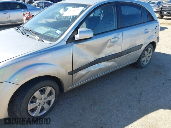 2009 Kia Rio LX with VIN KNADE243596530314, listed as a IAAI auction lot 41681050 with 114,831 mi miles. Bid and sale history available at carsss.com. Image 6.