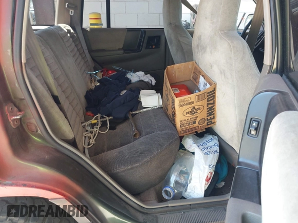 1995 Jeep Grand Cherokee Laredo with VIN 1J4GZ58Y6SC508349, listed as a IAAI auction lot 42630804 with 223,519 mi miles and . Bid and sale history available at DreamBid. Image 8.