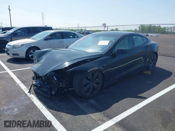 2022 Tesla Model S z VIN 5YJSA1E56NF490064, wystawiony jako IAAI lot #41858477 z przebiegiem Nie podano mil oraz . Historia ofert i sprzedaży dostępna na DreamBid. Obrazek 19.