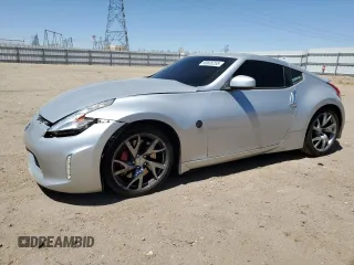 2014 Nissan 370Z with VIN JN1AZ4EHXEM636041, listed as a Copart auction lot 60835255 with 69,676 mi miles and Salvage title. Bid and sale history available at DreamBid. Image 1.
