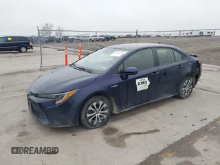 2021 Toyota Corolla Hybrid LE with VIN JTDEAMDE9MJ003172, listed as a IAAI auction lot 42062851 with 96,753 mi miles. Bid and sale history available at carsss.com. Image 2.