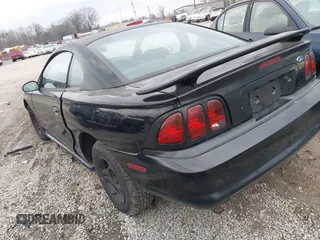 1997 Ford Mustang with VIN 1FALP4041VF129619, listed as a IAAI auction lot 41440766 with 135,934 mi miles. Bid and sale history available at carsss.com. Image 3.
