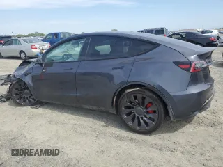 2021 Tesla Model Y Performance with VIN 5YJYGDEF2MF262273, listed as a Copart auction lot 50569245 with 90,879 mi miles and Salvage Title. Bid and sale history available at DreamBid. Image 2.