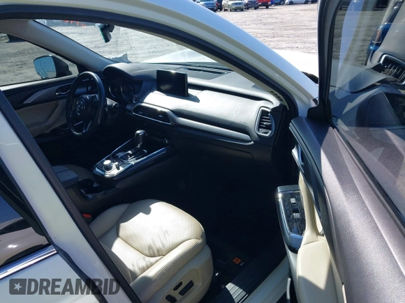 2019 Mazda CX-9 Touring z VIN JM3TCACY3K0333931, wystawiony jako IAAI lot #41968519 z przebiegiem 102 992 mil mil oraz . Historia ofert i sprzedaży dostępna na DreamBid. Obrazek 5.