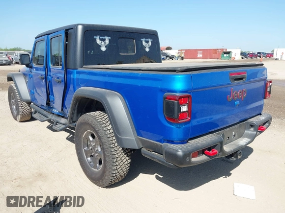 2023 Jeep Gladiator Rubicon with VIN 1C6JJTBG3PL581023, listed as a IAAI auction lot 41963931 with 15,023 mi miles and . Bid and sale history available at DreamBid. Image 3.