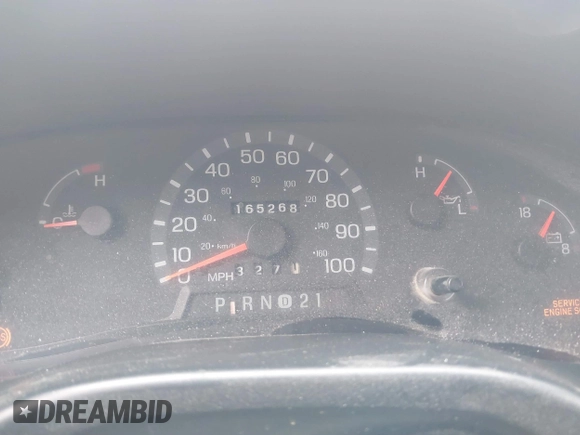 1999 Ford Econoline Cargo with VIN 1FDRE14W0XHB06565, listed as a IAAI auction lot 41496511 with 165,268 mi miles. Bid and sale history available at carsss.com. Image 7.