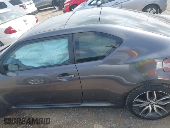 2015 Scion tC z VIN JTKJF5C70FJ013710, wystawiony jako IAAI lot #41770647 z przebiegiem Nie podano mil oraz . Historia ofert i sprzedaży dostępna na DreamBid. Obrazek 14.
