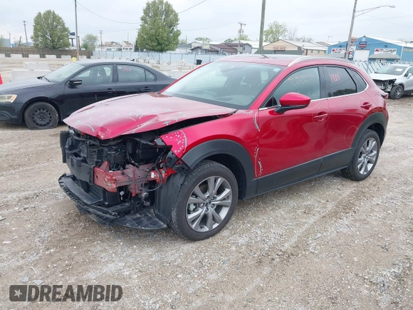 2023 Mazda CX-30 S Premium with VIN 3MVDMBDM3PM511402, listed as a IAAI auction lot 42180001 with 6,189 mi miles and . Bid and sale history available at DreamBid. Image 2.