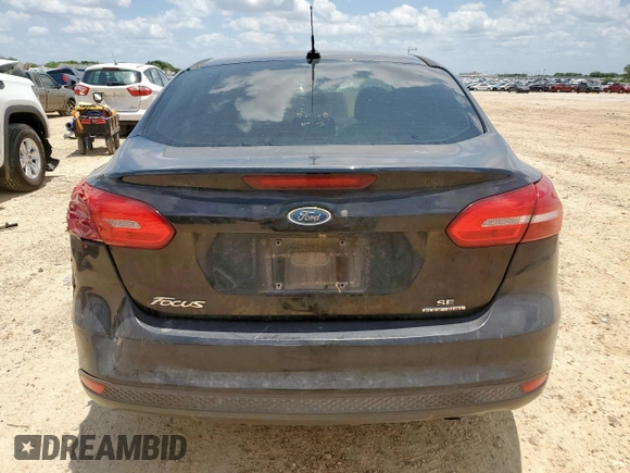 2016 Ford Focus SE with VIN 1FADP3F23GL271205, listed as a Copart auction lot 59395855 with 202,504 mi miles and Salvage title. Bid and sale history available at DreamBid. Image 6.