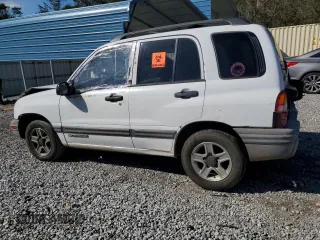 2003 Chevrolet Tracker z VIN 2CNBE13C736912038, wystawiony jako Copart lot #80422844 z przebiegiem 242 512 mil mil oraz Szkoda całkowita • Salvage title. Historia ofert i sprzedaży dostępna na DreamBid. Obrazek 2.