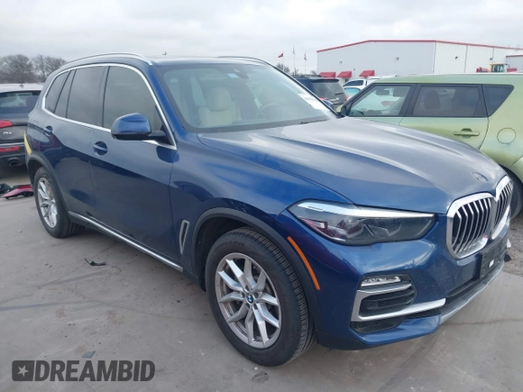 2020 BMW X5 sDrive40i with VIN 5UXCR4C07L9C27998, listed as a IAAI auction lot 41652088 with 59,009 mi miles and . Bid and sale history available at DreamBid. Image 1.