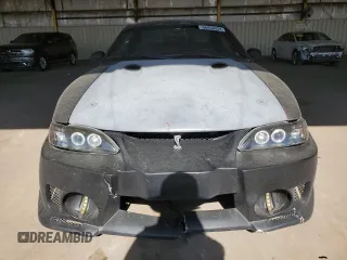 1997 Ford Mustang Cobra with VIN 1FALP47V8VF103811, listed as a Copart auction lot 56455324 with 129,499 mi miles and Salvage Title. Bid and sale history available at carsss.com. Image 5.