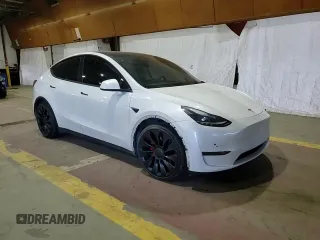 2022 Tesla Model Y Performance with VIN 7SAYGDEF7NF520825, listed as a Copart auction lot 57400245 with 55,437 mi miles and Salvage title. Bid and sale history available at DreamBid. Image 15.