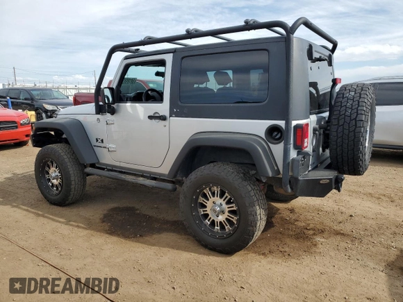 2009 Jeep Wrangler X with VIN 1J4FA24199L787574, listed as a Copart auction lot 58189835 with 74,331 mi miles and Salvage title. Bid and sale history available at DreamBid. Image 2.