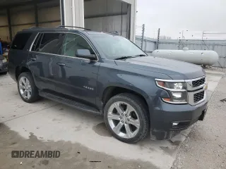 2019 Chevrolet Tahoe LT with VIN 1GNSKBKCXKR212450, listed as a Copart auction lot 54433205 with 119,907 mi miles and Salvage title. Bid and sale history available at DreamBid. Image 4.