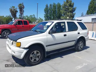1999 Isuzu Rodeo S z VIN 4S2CM58WXX4347611, wystawiony jako IAAI lot #42351641 z przebiegiem 256 007 mil mil oraz . Historia ofert i sprzedaży dostępna na DreamBid. Obrazek 6.