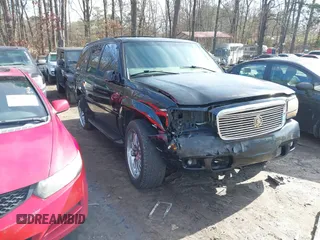 1999 Cadillac Escalade z VIN 1GYEK13R4XR411823, wystawiony jako IAAI lot #41221246 z przebiegiem 184 123 mil mil oraz . Historia ofert i sprzedaży dostępna na DreamBid. Obrazek 1.